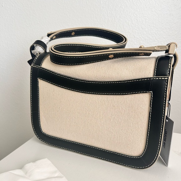 Jason Wu
Orbit Canvas / Leather Shoulder Bag NWT Color Beige/ Black - Picture 9 of 14